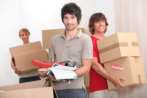 Packed moving boxes and furniture ready for removal service