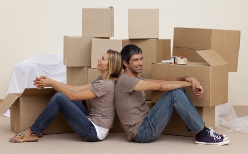 Packed boxes and household items ready for urgent removal