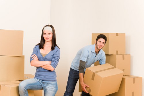 House movers carrying furniture from a family property in Bexleyheath
