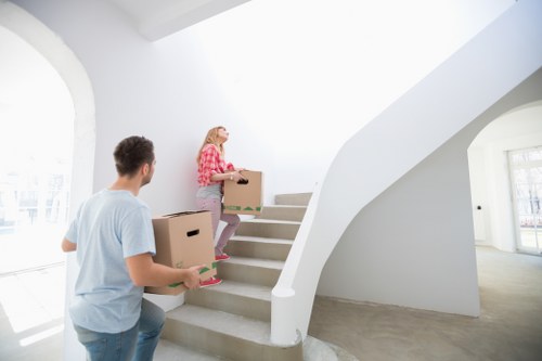 Local removals team handling a flat move with careful loading