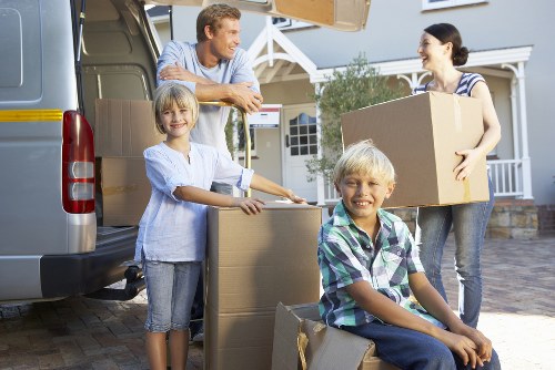 Careful packing and transport of business equipment during a local relocation